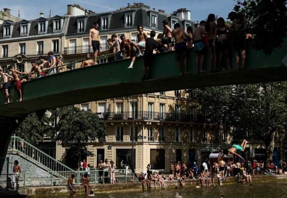 Parisians seek refuge from heatwave in air-conditioned hotels